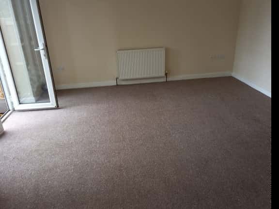 This is a photo of a cream lounge carpet taken in Kent that has been fully cleaned and looks perfect. Works completed by  The K&S Carpet Cleaners