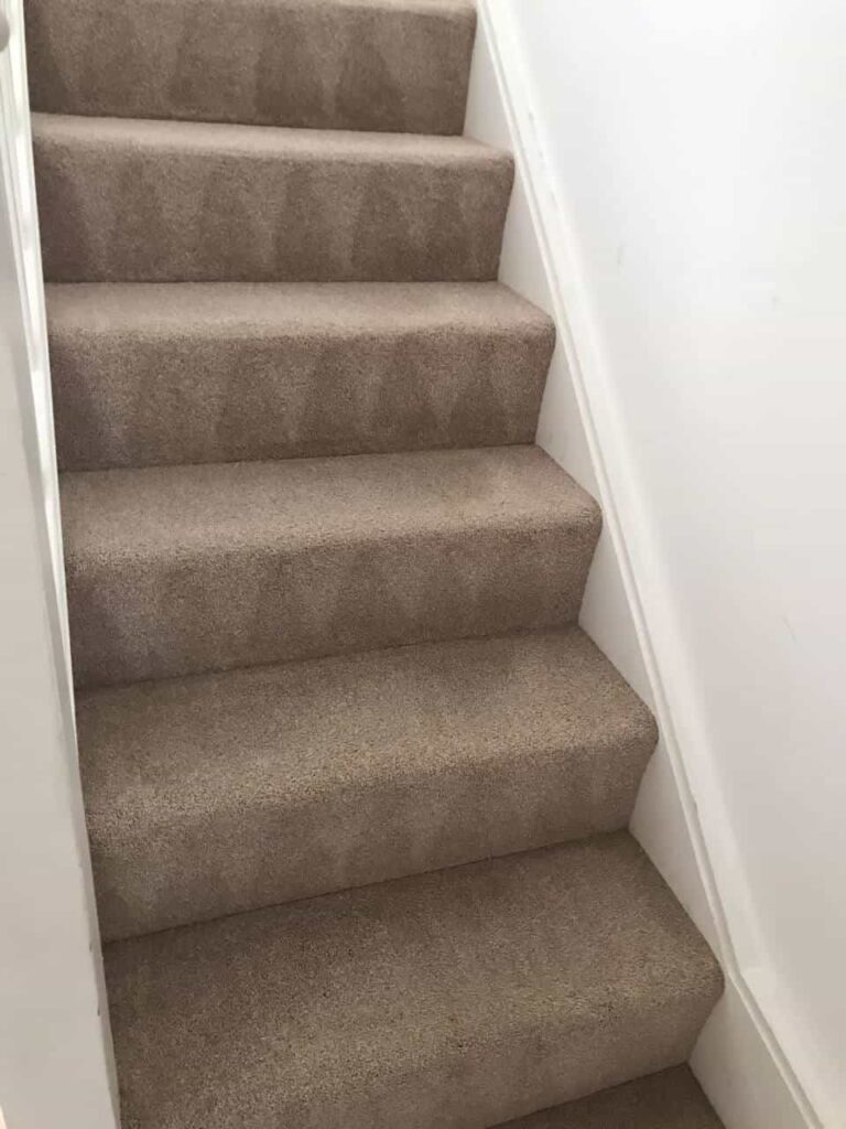 This is a BEFORE photo of a Grey sofa that has lots of stains on it. The sofa is just about to be cleaned by The K&S Carpet Cleaners. The photo was taken in Kent