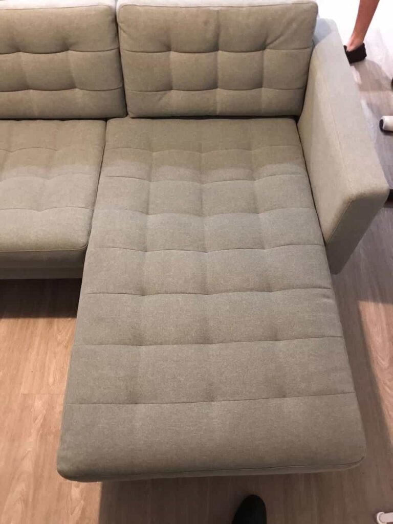 This is a photo of a grey sofa that has just been steam cleaned by The K&S Carpet Cleaners it is now spotless. This photo was taken on a job in Kent.